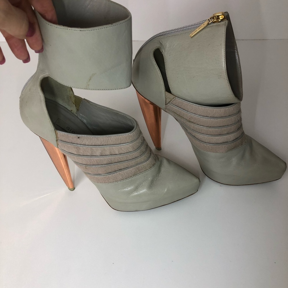 Gio Diev  leather ankle boots with fur accent.